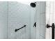Modern shower stall with light blue tiling, black hardware, and a convenient grab bar at 16113 E Andrew Dr, Fountain Hills, AZ 85268