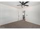 Bedroom featuring neutral walls, carpet, and a ceiling fan at 16567 N Slate Ln, Maricopa, AZ 85139