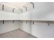Walk-in closet with shelving and ample storage space at 16567 N Slate Ln, Maricopa, AZ 85139