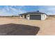 An elevated view of the house shows the desert landscaping and two car garage at 16567 N Slate Ln, Maricopa, AZ 85139