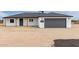 A pristine single-story home showcasing new dark roof and an integrated garage at 16567 N Slate Ln, Maricopa, AZ 85139