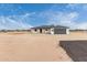 Charming single-story home features a new dark roof and a large garage door at 16567 N Slate Ln, Maricopa, AZ 85139
