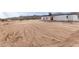 Back of home showing the neighboring desert landscape and mountain view at 16567 N Slate Ln, Maricopa, AZ 85139