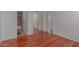 Spacious bedroom with hardwood floors and access to an ensuite bathroom at 16600 N Thompson Peak Pkwy # 1072, Scottsdale, AZ 85260