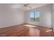 Bright, spacious bedroom has hardwood floors and a window overlooking the landscape at 16600 N Thompson Peak Pkwy # 1072, Scottsdale, AZ 85260