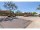 Community entrance to the ridge with an automated gate and beautiful trees and landscaping at 16600 N Thompson Peak Pkwy # 1072, Scottsdale, AZ 85260