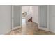 Bright open entryway with natural stone flooring, stairs, and white trim at 16600 N Thompson Peak Pkwy # 1072, Scottsdale, AZ 85260