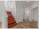 Bright foyer with stairs, unique flooring, and glimpses of a bathroom and additional room at 16600 N Thompson Peak Pkwy # 1072, Scottsdale, AZ 85260