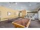 Community game room featuring a pool table, tables and chairs, and a kitchen area at 16600 N Thompson Peak Pkwy # 1072, Scottsdale, AZ 85260