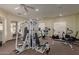 Community gym with multiple machines including treadmills, elliptical and weight lifting equipment at 16600 N Thompson Peak Pkwy # 1072, Scottsdale, AZ 85260