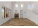 Bright living room with high ceilings, a fireplace, neutral walls, and tiled floors at 16600 N Thompson Peak Pkwy # 1072, Scottsdale, AZ 85260