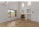 Spacious living room with fireplace, high ceilings, and tiled floors providing a cool atmosphere at 16600 N Thompson Peak Pkwy # 1072, Scottsdale, AZ 85260