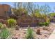 Signage for The Ridge at McDowell Mountain community, with desert landscaping including cacti at 16600 N Thompson Peak Pkwy # 1072, Scottsdale, AZ 85260