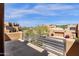 Balcony view overlooking the neighborhood with neutral colored homes and desert landscaping on a beautiful, sunny day at 17025 E La Montana Dr # 123, Fountain Hills, AZ 85268