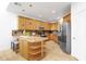 Bright kitchen boasts granite countertops, stainless steel appliances, and a central island with seating at 17025 E La Montana Dr # 123, Fountain Hills, AZ 85268