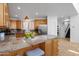 Bright kitchen featuring a granite island with bar seating, stainless steel appliances, and ample storage at 17025 E La Montana Dr # 123, Fountain Hills, AZ 85268