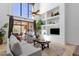 Sunlit living room with vaulted ceilings, modern furnishings, and a sliding glass door to the patio at 17025 E La Montana Dr # 123, Fountain Hills, AZ 85268