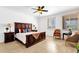 A bedroom filled with natural light features a dark wood bed frame and neutral tones at 17025 E La Montana Dr # 123, Fountain Hills, AZ 85268