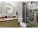 Updated bathroom with granite countertops, decorative mirror and a glass enclosed shower at 1741 S Clearview Ave # 70, Mesa, AZ 85209