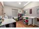 Bright craft room features desk space, organized storage, and a large work table for all creative projects at 1741 S Clearview Ave # 70, Mesa, AZ 85209