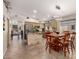 Open kitchen and dining area features tile flooring, ample counter space, stainless appliances, and natural light at 1741 S Clearview Ave # 70, Mesa, AZ 85209
