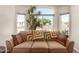 Bright sitting room with a large picture window and comfortable sofa at 1741 S Clearview Ave # 70, Mesa, AZ 85209