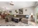 Comfortable living room featuring a large sectional sofa and open layout to the kitchen and dining area at 1741 S Clearview Ave # 70, Mesa, AZ 85209