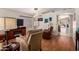 Cozy living room featuring hardwood floors, modern furniture, and stylish decor leading into another room at 1741 S Clearview Ave # 70, Mesa, AZ 85209