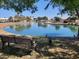 Scenic view of the neighborhood pond, with seating available and surrounded by trees at 1741 S Clearview Ave # 70, Mesa, AZ 85209