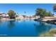 Peaceful waterfront view showcases the calm canal waters and surrounding residential neighborhood on a clear day at 1741 S Clearview Ave # 70, Mesa, AZ 85209