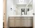 Bathroom features a spacious vanity with storage and a large mirror at 17494 N Maddaloni Ave, Maricopa, AZ 85138