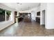 Open kitchen features stainless steel appliances, an island, and an adjacent dining area for easy entertaining at 17494 N Maddaloni Ave, Maricopa, AZ 85138