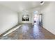 Open-concept space with tile flooring and front door at 17494 N Maddaloni Ave, Maricopa, AZ 85138