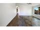 Open-concept space with tile flooring and view to hall at 17494 N Maddaloni Ave, Maricopa, AZ 85138