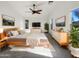 Spacious main bedroom with large windows, ceiling fan, and modern furnishings at 17494 N Maddaloni Ave, Maricopa, AZ 85138