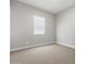 Bright and spacious bedroom with soft carpeting and large window at 17621 W Pierson St, Goodyear, AZ 85395