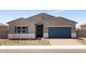 Charming single-story home featuring a 2-car garage and desert landscaping at 17621 W Pierson St, Goodyear, AZ 85395