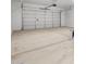 The expansive garage features a bright interior and ample space for parking and storage at 17621 W Pierson St, Goodyear, AZ 85395