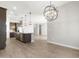 Kitchen featuring tile flooring and gray kitchen island at 17621 W Pierson St, Goodyear, AZ 85395