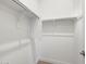 Walk-in closet with hanging rods, perfect for organizing clothes and accessories at 17621 W Pierson St, Goodyear, AZ 85395
