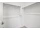 Bright walk-in closet with sturdy rods and shelving for optimal organization and storage at 17621 W Pierson St, Goodyear, AZ 85395