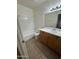 Bright bathroom with white tiled shower-tub, vanity with light countertop, and ceramic tile flooring at 1825 W Ray Rd # 1058, Chandler, AZ 85224