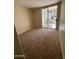 Bedroom with glass sliding doors that provide ample light and outdoor access at 1825 W Ray Rd # 1058, Chandler, AZ 85224