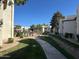 Beautifully landscaped neighborhood with walkways and well-maintained building exteriors at 1825 W Ray Rd # 1058, Chandler, AZ 85224