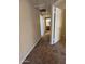 Hallway with neutral paint and carpet leading to bathroom and bedrooms at 1825 W Ray Rd # 1058, Chandler, AZ 85224
