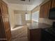 Kitchen dining area features a breakfast bar and carpeted flooring at 1825 W Ray Rd # 1058, Chandler, AZ 85224