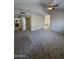 Spacious living room with carpeting and access to other rooms at 1825 W Ray Rd # 1058, Chandler, AZ 85224