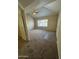 Comfortable living room features plush carpeting and a bright window at 1825 W Ray Rd # 1058, Chandler, AZ 85224