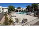 Enjoy this spacious community pool with ample seating, beautiful trees, and desert landscaping at 1825 W Ray Rd # 1058, Chandler, AZ 85224