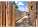 Enclosed backyard featuring a brick wall and walkway, offering privacy and functionality at 1939 E Solano Dr, Phoenix, AZ 85016